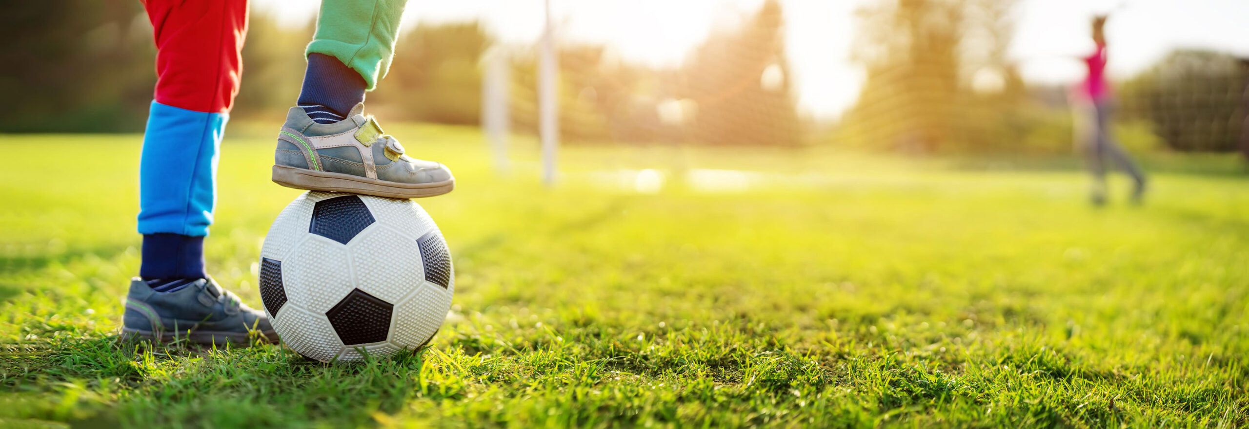 children playing soccer in field